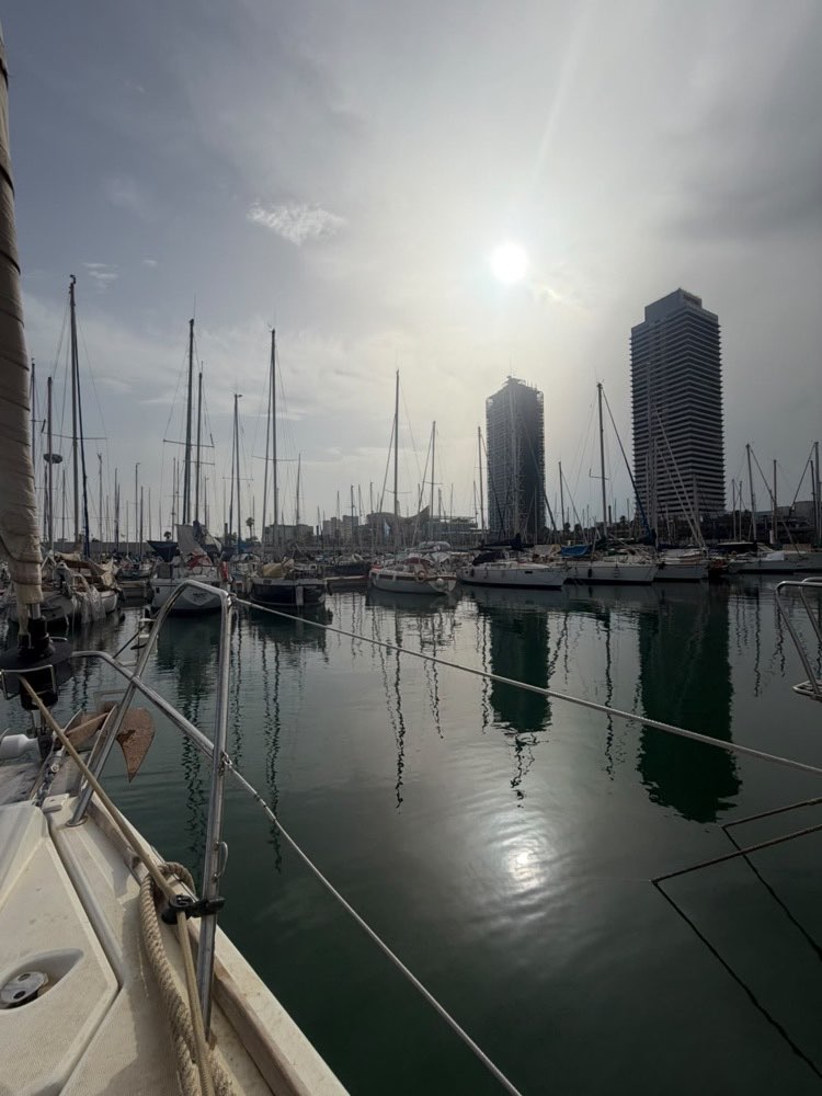 The marina at golden hour, seen from the bow