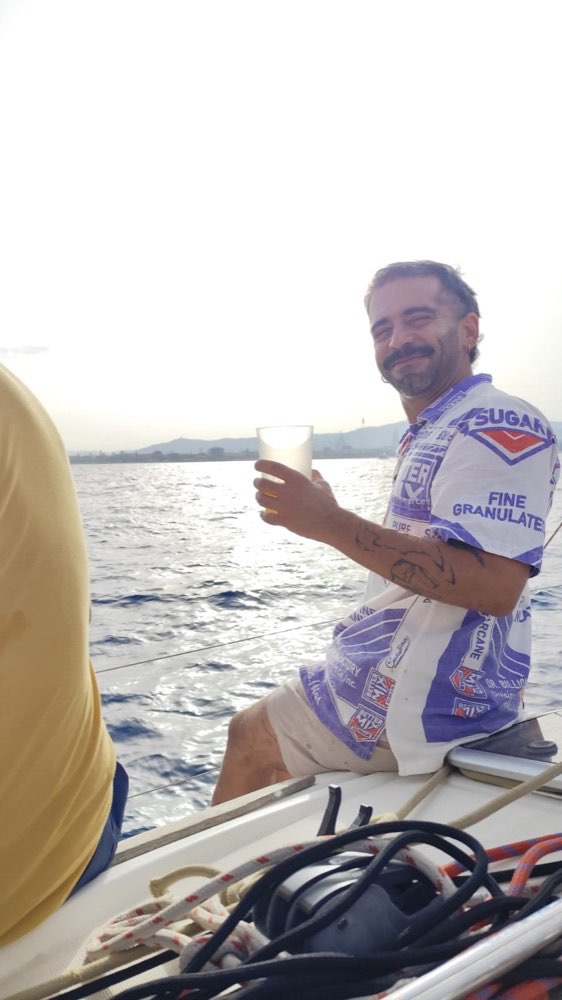 A guest enjoying a drink on deck